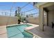 Screened-in pool with lounge chairs and a grill for outdoor entertaining at 8961 Cabot Cliffs Dr, Davenport, FL 33896