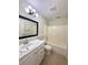 Traditional bathroom features a tub/shower combo and modern white vanity at 1001 Golfside Ct, Kissimmee, FL 34741