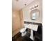 Full bathroom featuring a tile shower, toilet, and a pedestal sink at 1001 Golfside Ct, Kissimmee, FL 34741