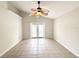 Bedroom with tile flooring and access to back yard at 1001 Golfside Ct, Kissimmee, FL 34741