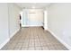 Spacious bedroom with tile flooring and a pair of sliding closet doors at 1001 Golfside Ct, Kissimmee, FL 34741