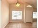 Cozy dining area with tile floor and chandelier lighting at 1001 Golfside Ct, Kissimmee, FL 34741
