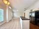Kitchen and dining area boasts tile floors, and stainless steel refrigerator and appliances at 1001 Golfside Ct, Kissimmee, FL 34741