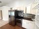Well-equipped kitchen showcasing stainless steel appliances and custom cabinets at 1001 Golfside Ct, Kissimmee, FL 34741