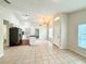 Open concept living area flowing into the kitchen with modern appliances at 1001 Golfside Ct, Kissimmee, FL 34741