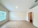 Inviting living area with tile flooring, neutral paint, and natural light at 1001 Golfside Ct, Kissimmee, FL 34741