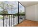 An outdoor balcony featuring tiled flooring and an open view of the parking lot at 1221 S Pine Ridge Cir # A2, Sanford, FL 32773
