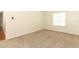 A bright bedroom with neutral carpet and large window at 1221 S Pine Ridge Cir # A2, Sanford, FL 32773