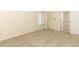 Bedroom featuring neutral carpet, closet, window with blinds and access to an ensuite bathroom at 1221 S Pine Ridge Cir # A2, Sanford, FL 32773