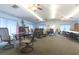 Spacious clubhouse interior with tables, chairs, and a piano, perfect for community gatherings and events at 1221 S Pine Ridge Cir # A2, Sanford, FL 32773
