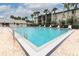 Inviting community swimming pool with lounge chairs, perfect for relaxation and enjoying sunny days at 1221 S Pine Ridge Cir # A2, Sanford, FL 32773