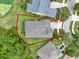 Aerial view of house in landscaping with a red boundary line marking the parcel at 1375 Brayford Point, Deland, FL 32724