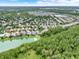 Aerial view of home and neighborhood, showing proximity to lake and trees at 1375 Brayford Point, Deland, FL 32724