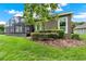 Exterior view of home with well-maintained yard and an enclosed screened lanai at 1375 Brayford Point, Deland, FL 32724