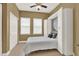 Cozy bedroom with Murphy bed, ample natural light, and neutral tones, perfect for relaxation at 1375 Brayford Point, Deland, FL 32724