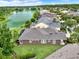 Beautiful exterior of home with lake view and well-maintained landscaping at 1375 Brayford Point, Deland, FL 32724