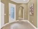 Bright foyer featuring tile floors and decorative glass front door at 1375 Brayford Point, Deland, FL 32724