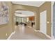 Open-concept foyer with tiled floors offers view of the kitchen and dining area at 1375 Brayford Point, Deland, FL 32724