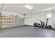 Spacious garage with painted floor and walls, and an automatic door; room for vehicles and storage at 1375 Brayford Point, Deland, FL 32724