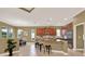 Open concept kitchen featuring an island, seating, recessed lighting and stainless appliances at 1375 Brayford Point, Deland, FL 32724