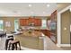 Kitchen with large island, stainless appliances, and sleek countertops at 1375 Brayford Point, Deland, FL 32724