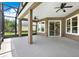 Covered and screened lanai with ceiling fans, offering a comfortable outdoor living space at 1375 Brayford Point, Deland, FL 32724