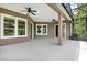 Covered and screened lanai with ceiling fans, perfect for enjoying the outdoors at 1375 Brayford Point, Deland, FL 32724