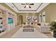 Stylish living room showcases built-in shelving and decor, perfect for a modern lifestyle at 1375 Brayford Point, Deland, FL 32724