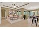 Bright living room with elegant decor, comfortable seating, and ample natural light at 1375 Brayford Point, Deland, FL 32724
