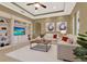 Inviting living room offers a blend of comfort and style with custom shelving and neutral tones at 1375 Brayford Point, Deland, FL 32724