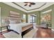 Well-appointed bedroom featuring an outdoor view and an adjacent seating area for relaxing at 1375 Brayford Point, Deland, FL 32724
