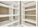 Organized walk-in closet offers ample storage with custom shelving, perfect for an organized wardrobe at 1375 Brayford Point, Deland, FL 32724