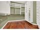 Large walk-in closet with custom shelving and drawers for ample storage solutions at 1375 Brayford Point, Deland, FL 32724