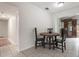 Bright dining area with a simple round table and three chairs at 1405 Montclair Ct, Orlando, FL 32812