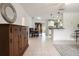 Open concept living space showcases a dining area flowing into a kitchen with stylish decor and tile flooring at 1405 Montclair Ct, Orlando, FL 32812