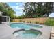 Sparkling backyard pool and spa offers a luxurious outdoor space for relaxation and entertainment at 1405 Montclair Ct, Orlando, FL 32812