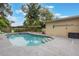 Backyard pool offers a serene and private retreat for relaxation and recreation at 1405 Montclair Ct, Orlando, FL 32812
