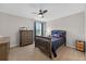 bedroom features a navy blue anchor themed bed set and carpeted floors at 15318 Sandfield Loop, Winter Garden, FL 34787