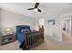 Comfortable bedroom featuring an anchor-themed bedding set and carpeted floors at 15318 Sandfield Loop, Winter Garden, FL 34787