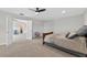 Serene bedroom featuring neutral walls, plush carpet, and multiple entryways for convenience at 15318 Sandfield Loop, Winter Garden, FL 34787