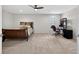 Inviting bedroom with a comfortable bed, a functional workstation, and a ceiling fan for optimal comfort at 15318 Sandfield Loop, Winter Garden, FL 34787