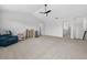 Large bonus room features neutral walls, a ceiling fan, and plush carpeting at 15318 Sandfield Loop, Winter Garden, FL 34787