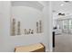 Hallway display with ornate figurines and candles in a decorative alcove with a glimpse to the main bedroom at 15318 Sandfield Loop, Winter Garden, FL 34787