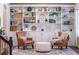 Stylish living room featuring custom built-in shelving, comfortable seating, and elegant decor creating a cozy atmosphere at 15318 Sandfield Loop, Winter Garden, FL 34787