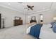 Large main bedroom with trey ceilings, neutral carpeting, and two dressers with mirrors at 15318 Sandfield Loop, Winter Garden, FL 34787