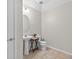 Powder room featuring a pedestal sink, modern fixtures, and neutral paint at 15318 Sandfield Loop, Winter Garden, FL 34787