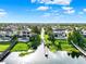 Aerial view of waterfront homes that have private pools with lake access in a tropical setting at 15613 Camp Dubois Cres, Winter Garden, FL 34787