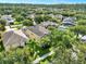 Aerial view featuring a home, greenery, and well-manicured landscaping at 15613 Camp Dubois Cres, Winter Garden, FL 34787