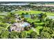 Gorgeous aerial view of the neighborhood amenities featuring a pool, tennis courts and a large lake at 15613 Camp Dubois Cres, Winter Garden, FL 34787