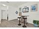 Stylish bar area with seating and beach themed decor, perfect for entertaining at 15613 Camp Dubois Cres, Winter Garden, FL 34787